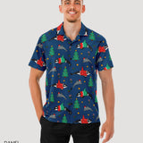 Man wearing a colorful patterned shirt with Christmas-themed designs on a plain background