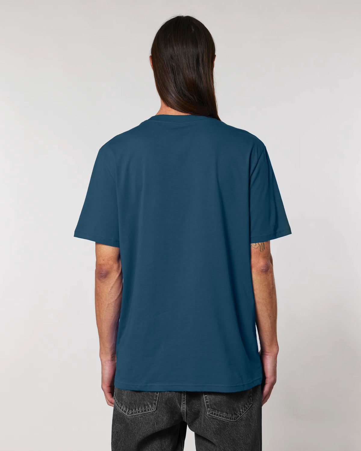 Person wearing Golphin Dark embroidered golf t-shirt casual style in deep teal
