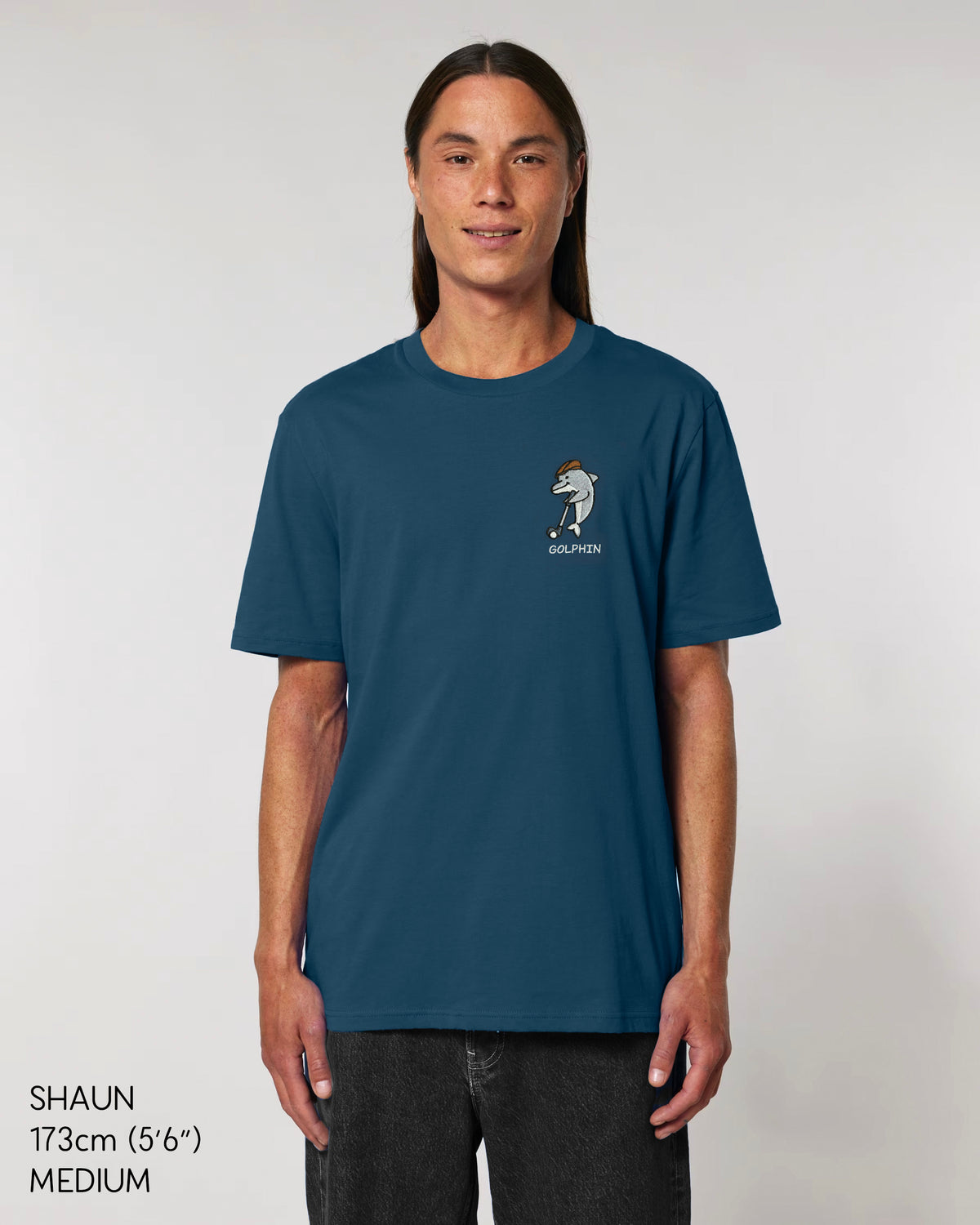 Person wearing Golphin Dark embroidered golf t-shirt casual style in deep teal